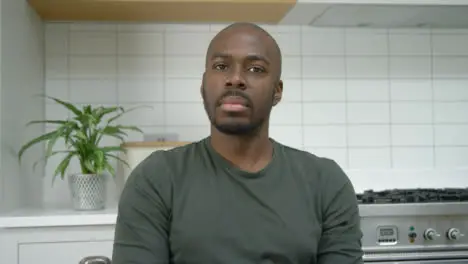 Middle Aged Man Listening Whilst Looking Directly into Webcam During a Video Conference