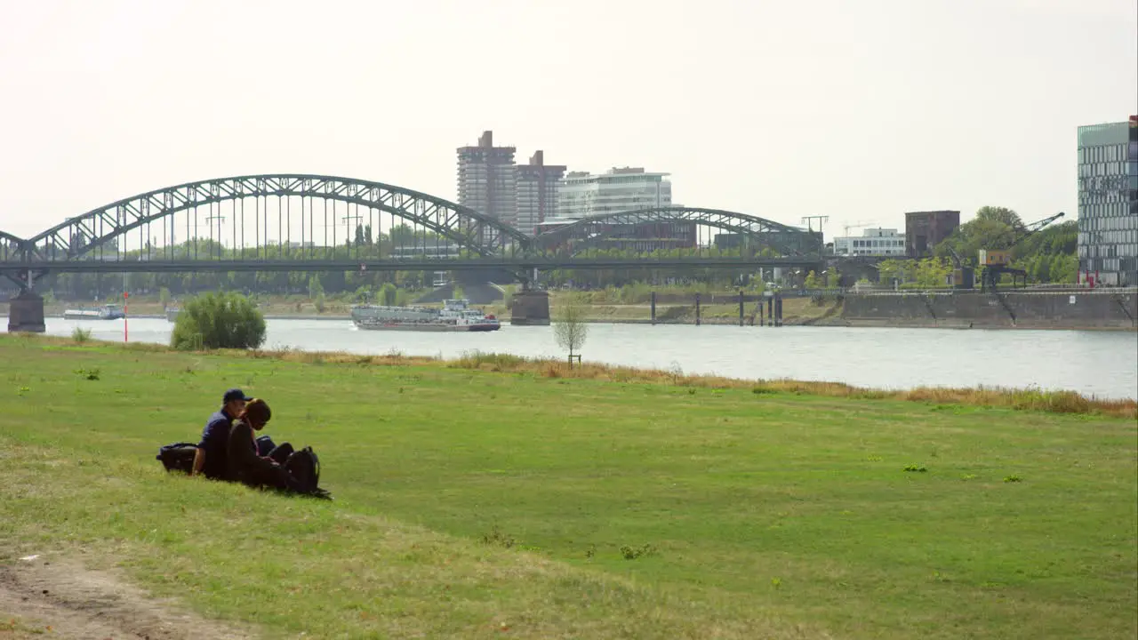 Couple on Riverbank in Cologne 4K