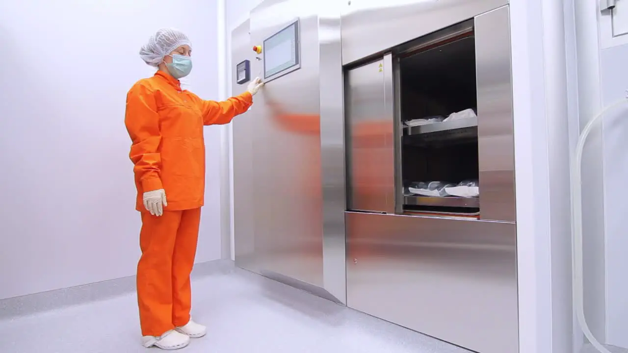 Woman in orange sterility suit