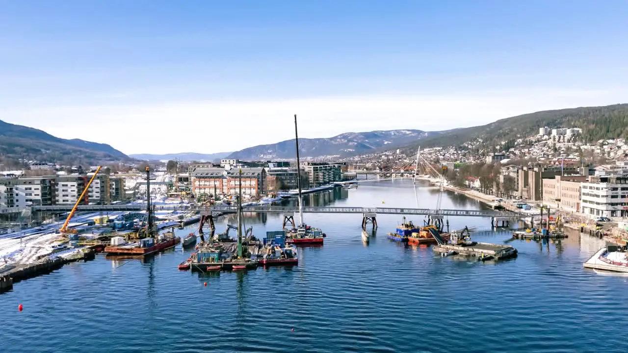 Hyperlapse of dragging boats and building platforms in the river