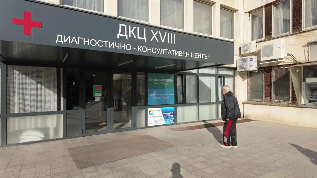 Old people walking in and out of a Clinic in Sofia Bulgaria