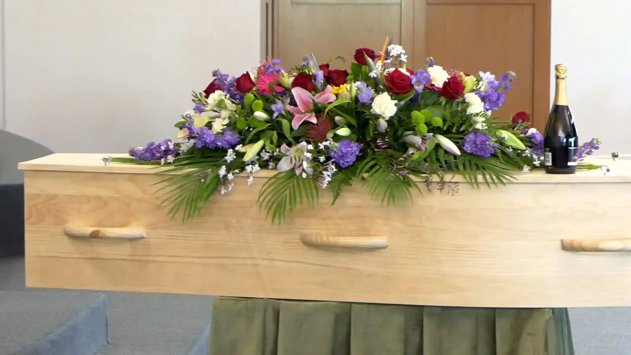 closeup shot of a funeral casket in a hearse or chapel or burial at cemetery