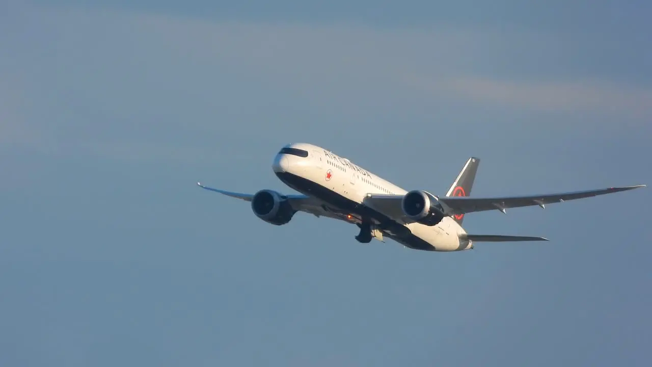 Air Canada airplane flying and turning in sky