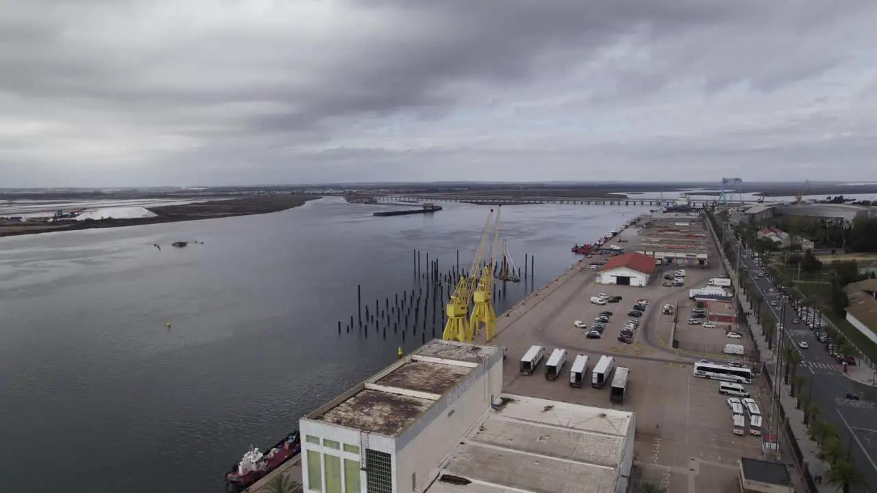 Aerial arc at Port of Huelva in Spain on Odiel river overcast day