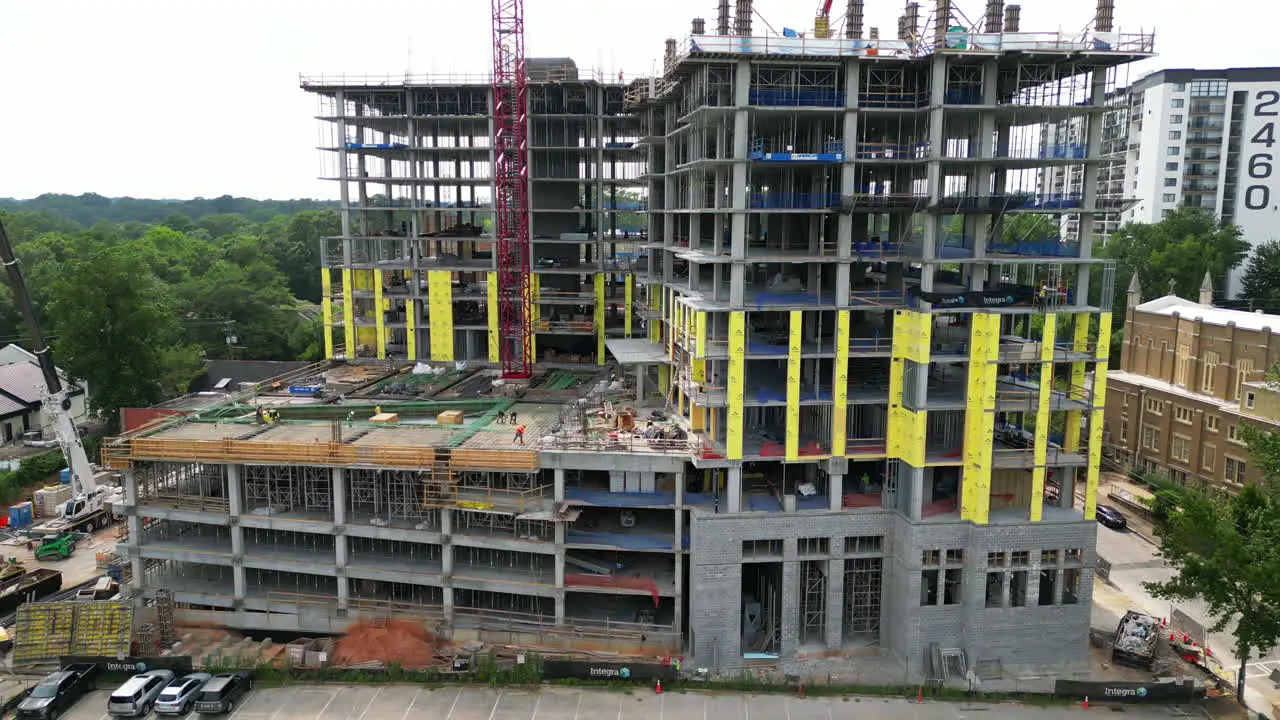 Aerial footage of modern multistorey building construction site