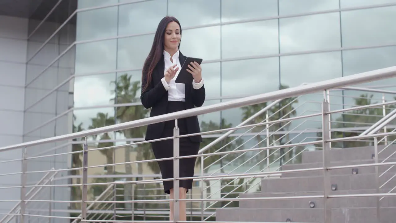 Young businesswoman standing on a concourse