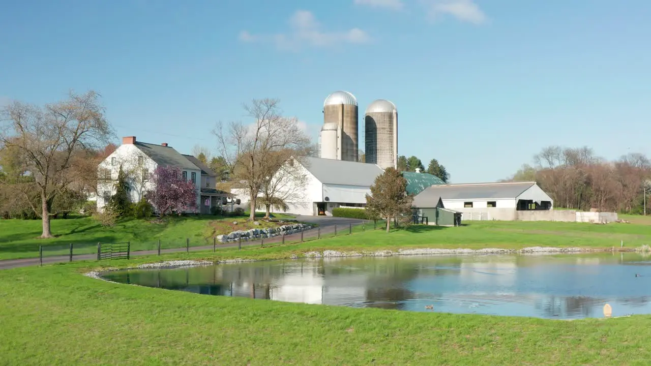 Rising aerial reveals traditional American farm