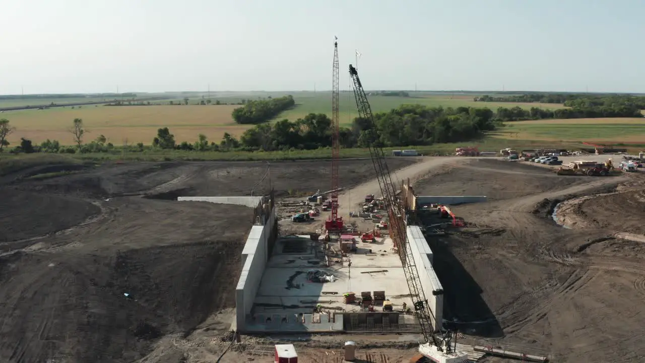 Crawler cranes erected on rural countryside construction site building infrastructure