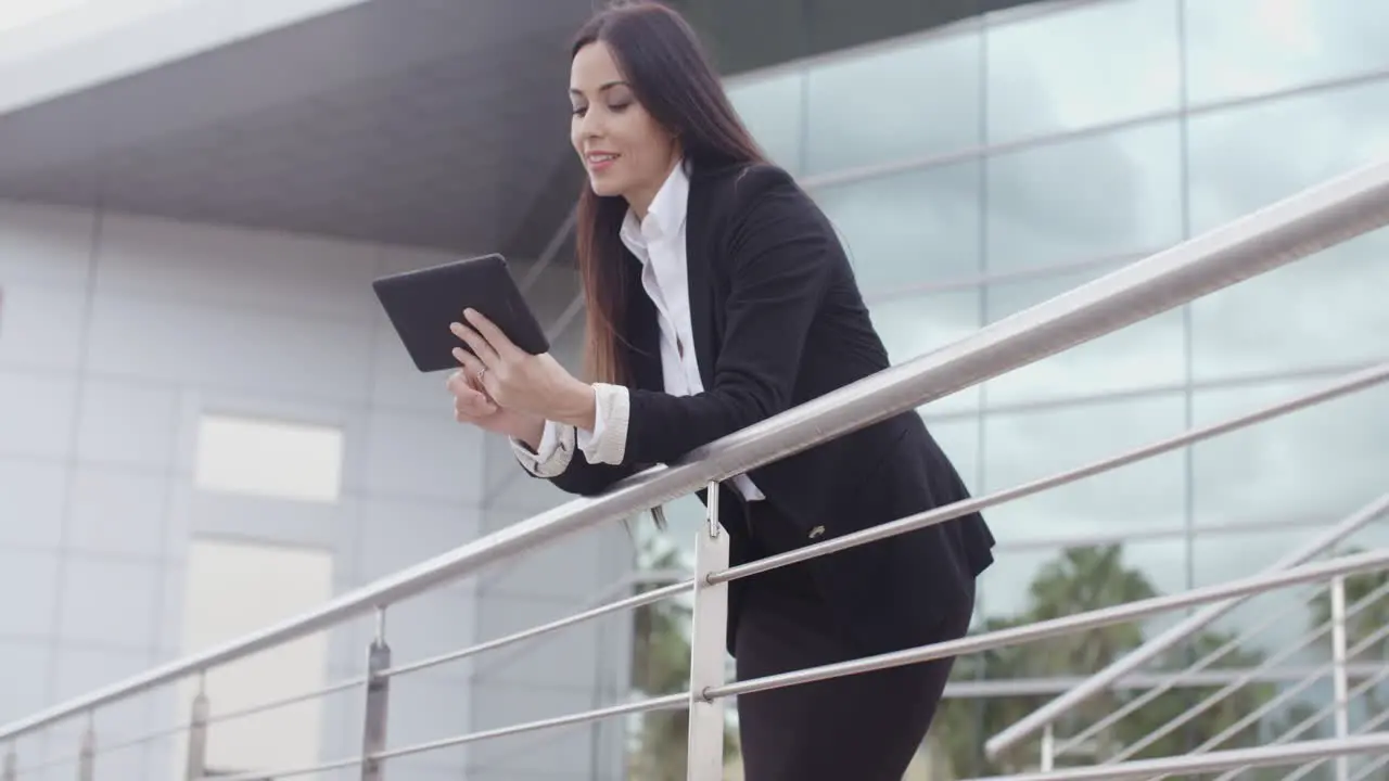 Young businesswoman browsing on her tablet