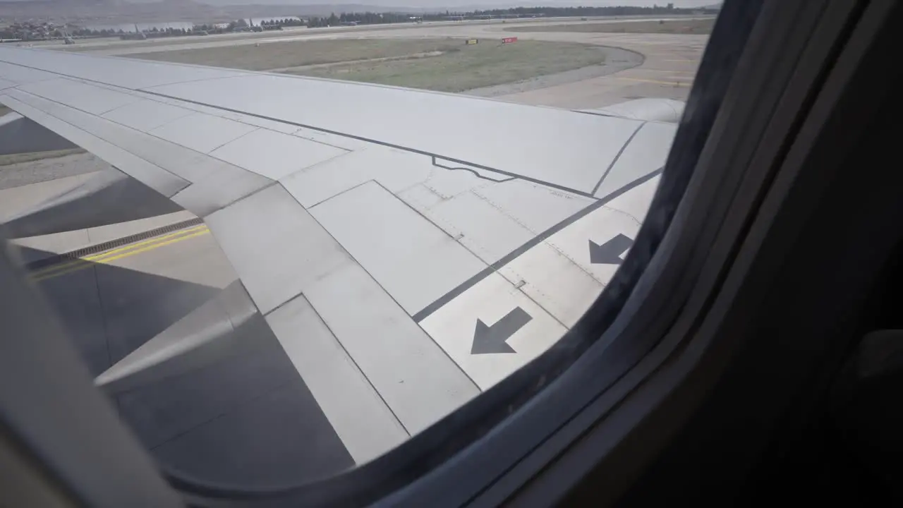 Airplane reversing on runway getting ready for take-off at airport