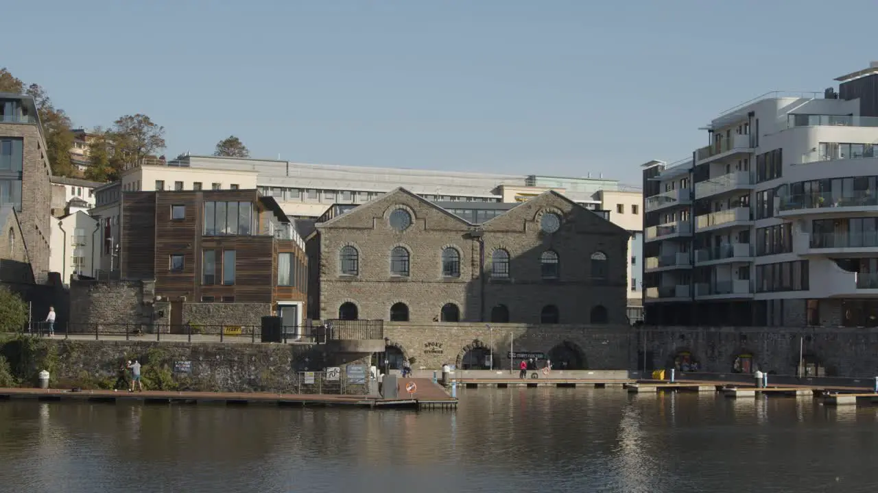 Wide Shot of People Along Waterside Area of Bristol England 