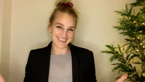 Young Woman On Business Video Call Briefing Others Whilst Looking Directly to Camera