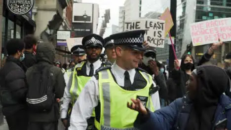 London Protester Talking to Police Officer During March