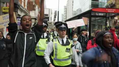 London Protesters Chanting Beside Police Officers