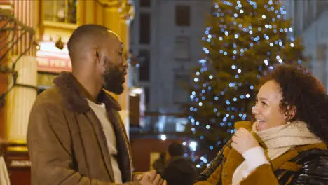 Couple In Front Of Christmas Tree In Leadenhall Market London UK