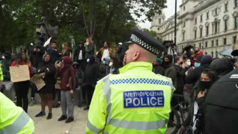 London Police Officer Monitors Protestors During Black Lives Matter Demonstrations