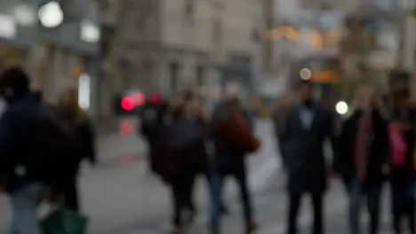 Defocused Long Shot of People Walking Along Busy Street In Oxford England