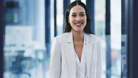 Portrait of a happy young business woman laughing