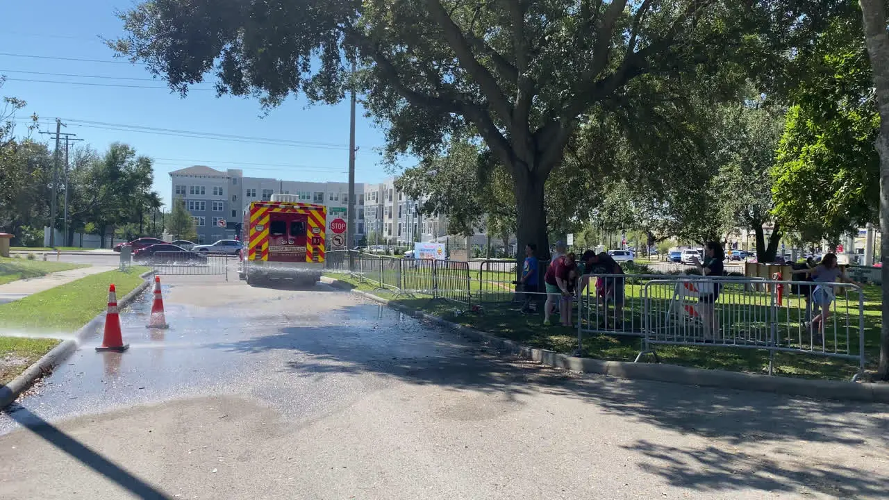 Children being shown how to use a firefighter house at a public open house event on fire and safety on a sunny day in Tampa Florida USA