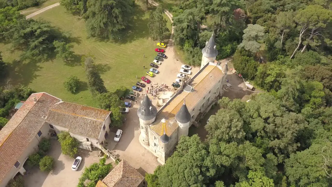 Murviel-les-Béziers France May 2018  Aerial drone view of an exhibition of old vintage cars in front of a castle