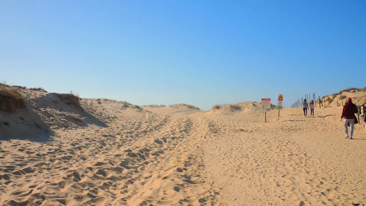 Low angle shot of many tourists enjoying a visit to the landmark dune de Pilat along south west coast Les Landes  France on a sunny day