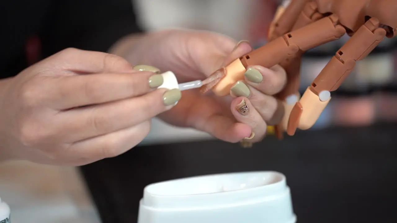 Teaching how to manicure on industrialist hand