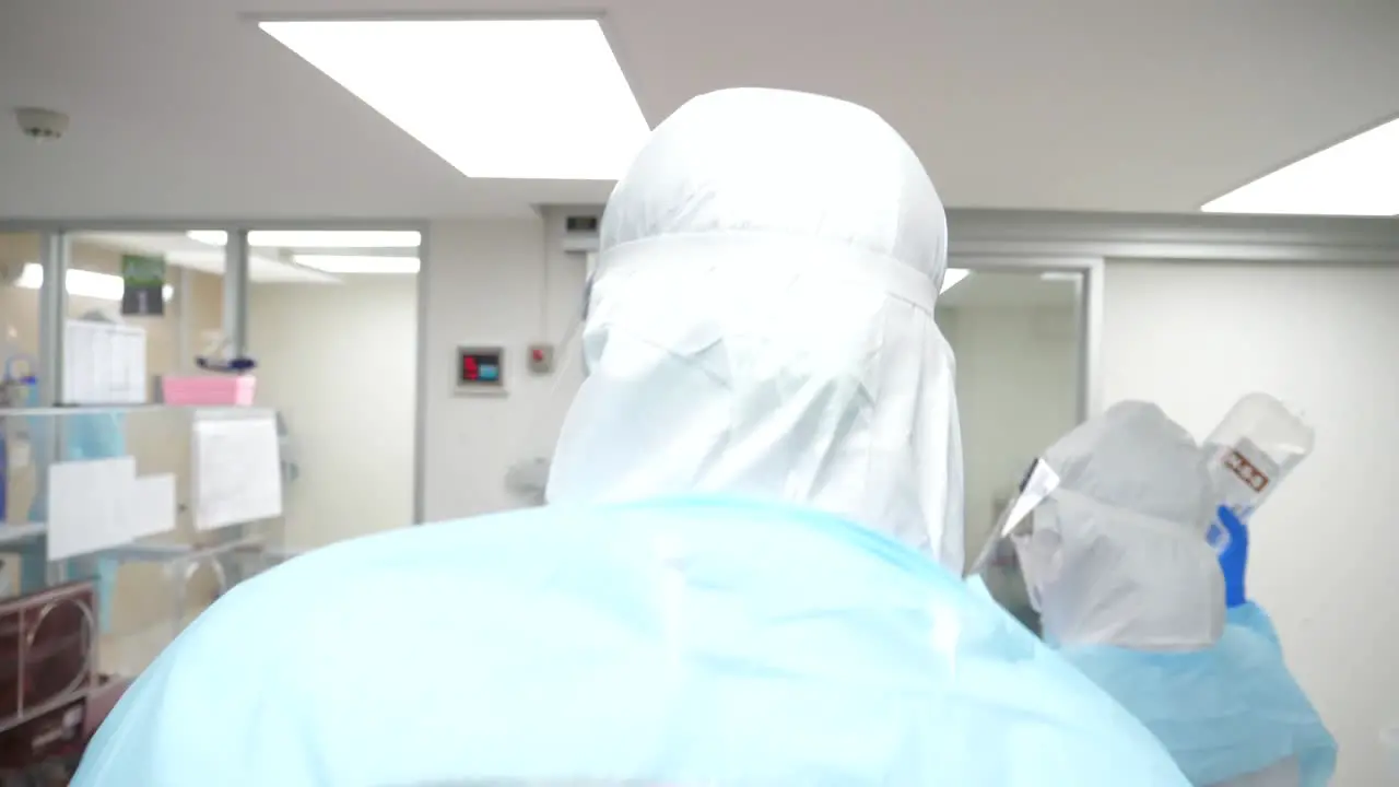 Medic Staffs Wearing Fully Protection Suits While Taking Care Of COVD-19 Patient