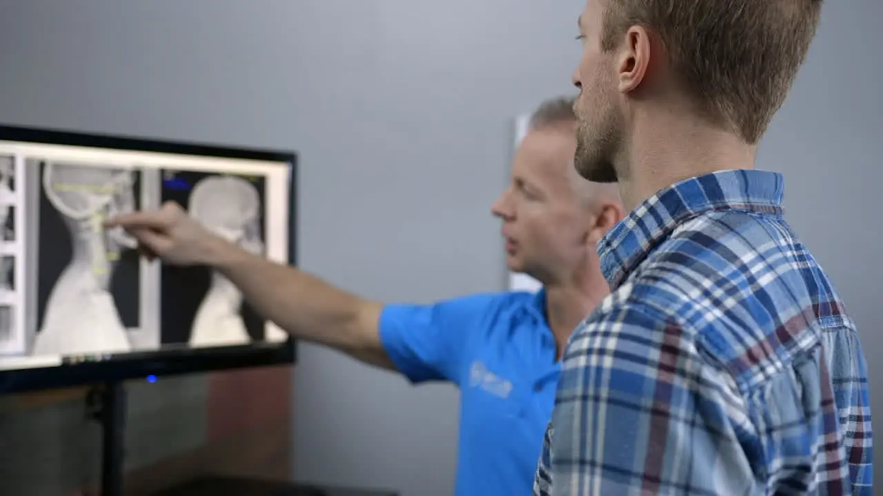 A Chiropractor explains x rays to a patient