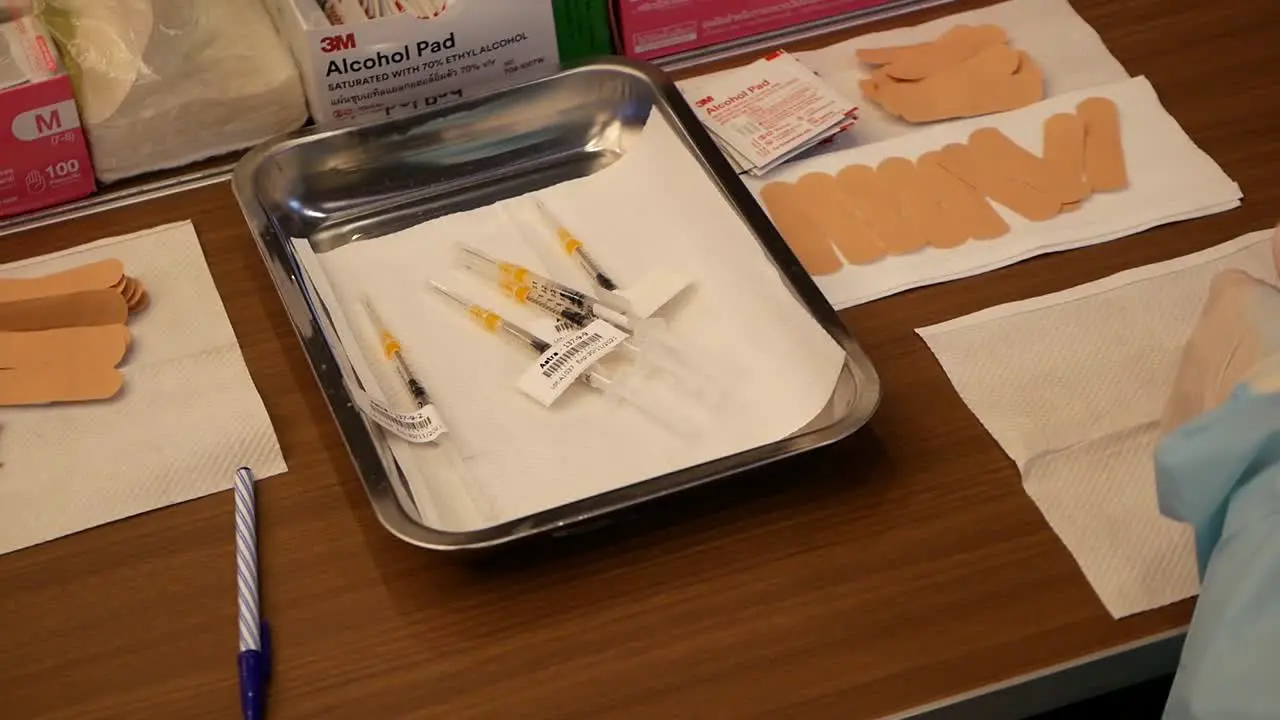 Close Up Footage of Nurse Putting Coronavirus Vaccine Label On The Needle Preparing For The Injection To People