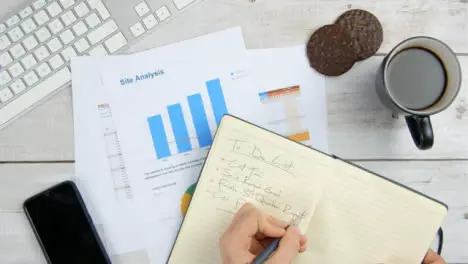 Top View Male Hands Crossing Item Off To Do List