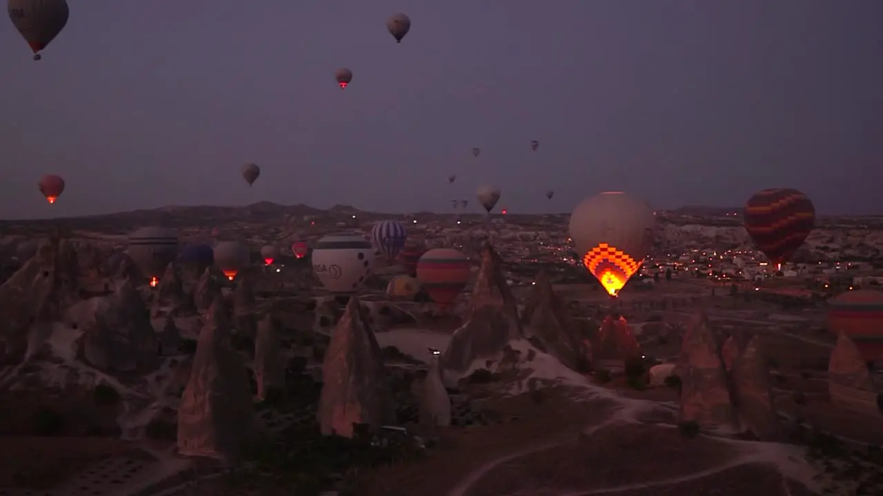 Sunrise view from a balloon of the balloons taking off in Goreme Cappadocia