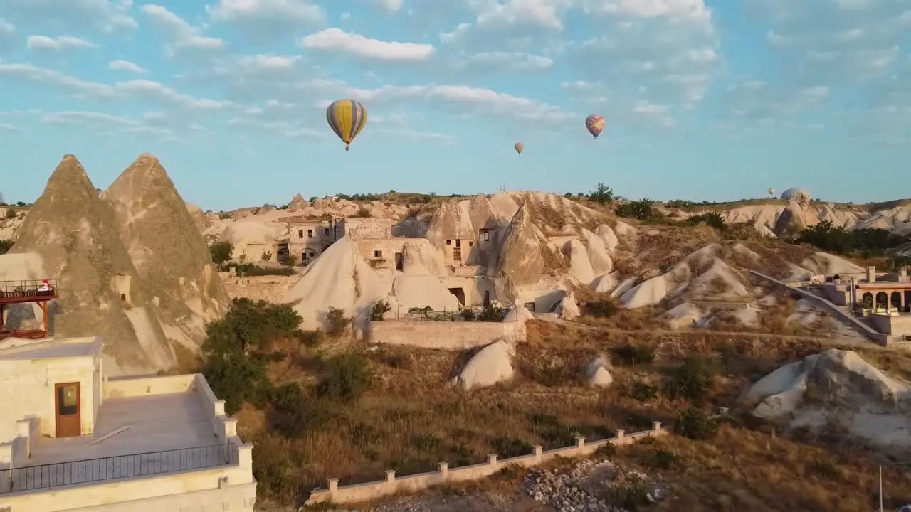 Balloons flying above Goreme at sunrise in Cappadocia Turkey