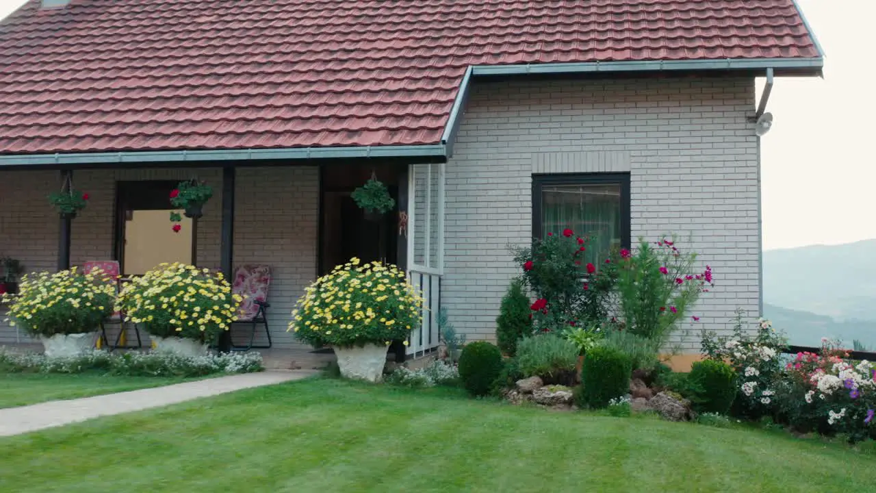 Mountainside cottage house with beautiful spring garden path to entrance