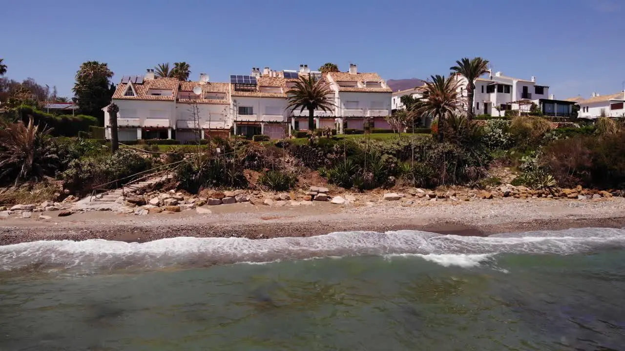 Aerial View Of Sea Waves Breaking On Beach With View Of Holiday Villas In Estepona Costa del Sol