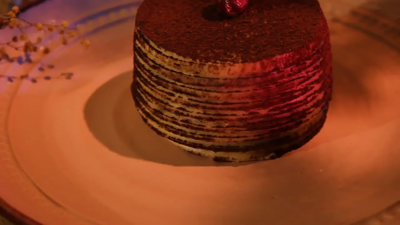 Whole Sweet Chocolate Cake In Plate With Dim Light