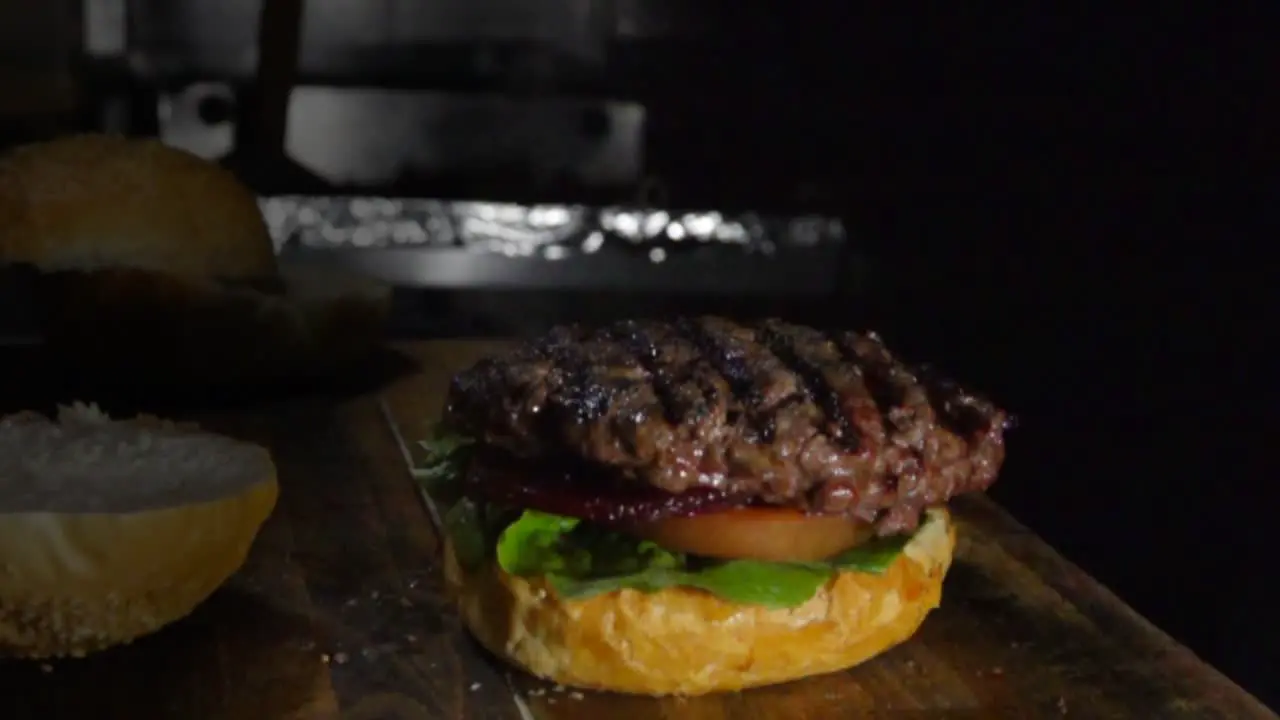 Slow motion shot of preparing a fresh burger at home