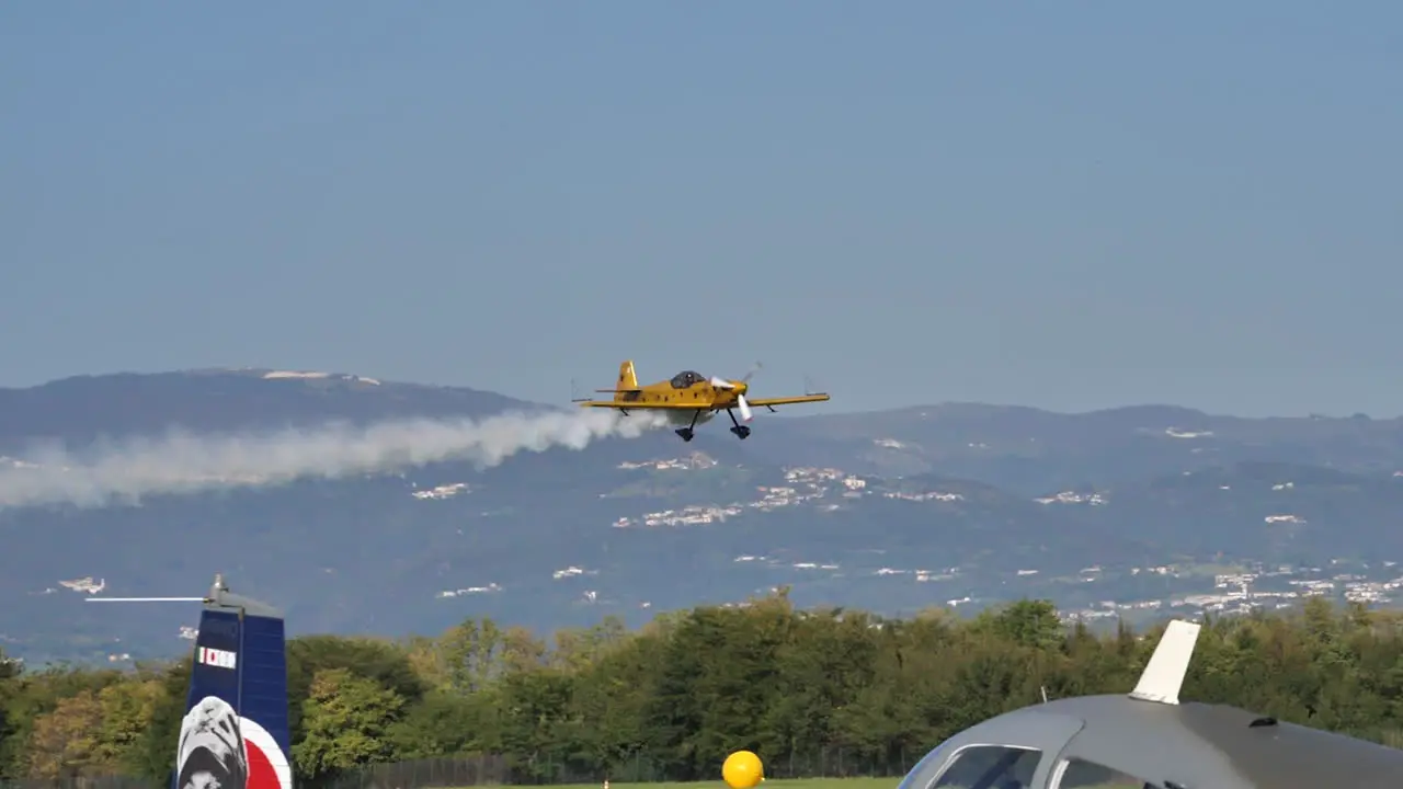 Aerobatic Mudry CAP 230 aircraft taking off at Thiene Italy airshow