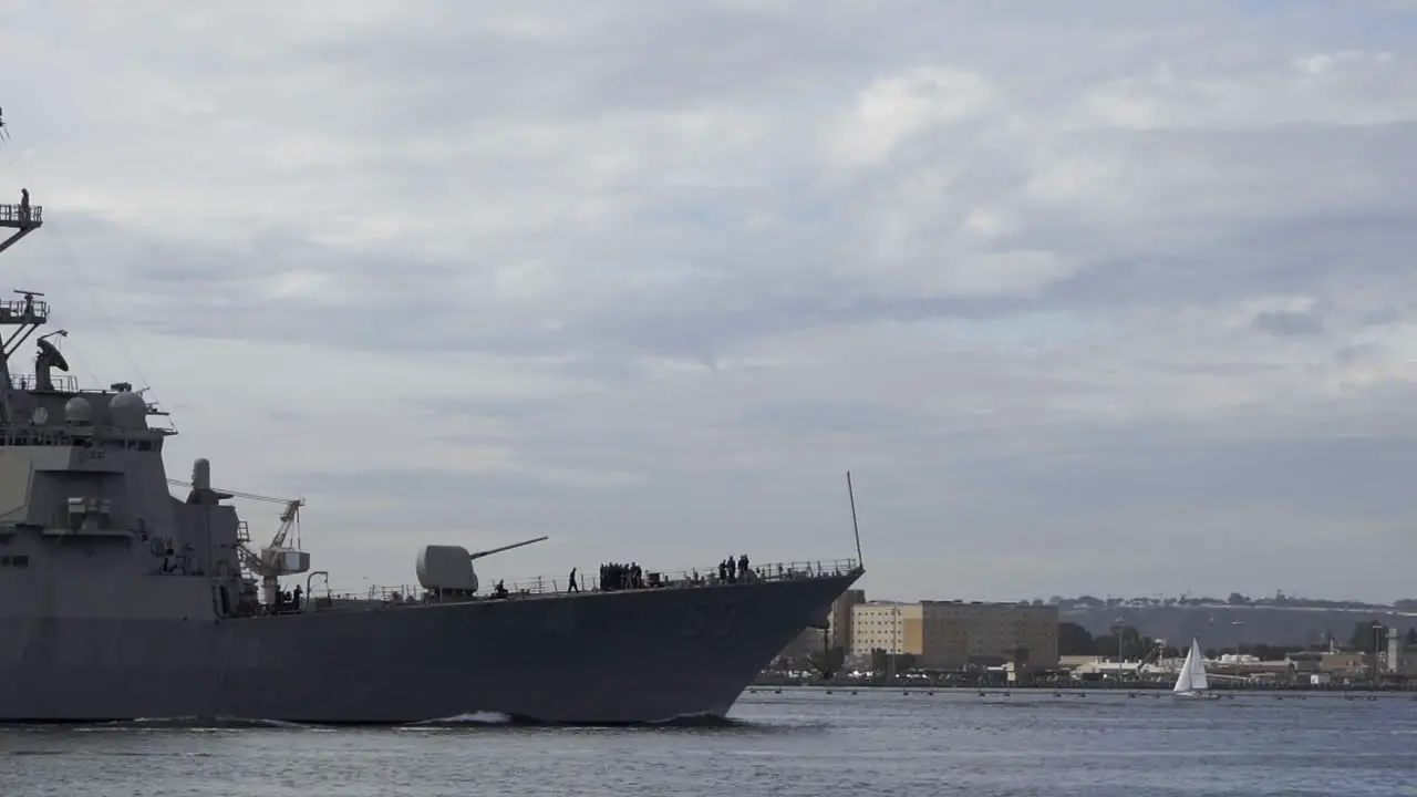 Large naval carrier passing by downtown San Diego