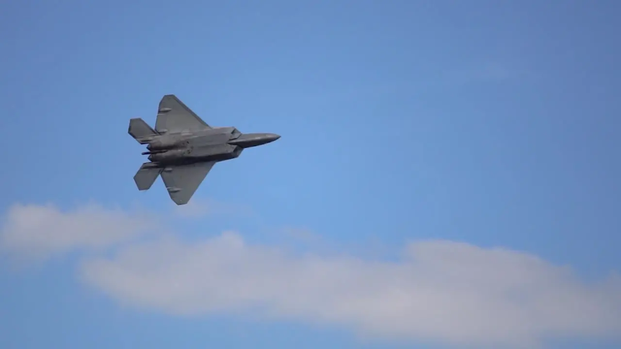 An advanced technology fighter jet The F-22 Raptor does a fly by during a demonstration at Wings over Houston Airshow