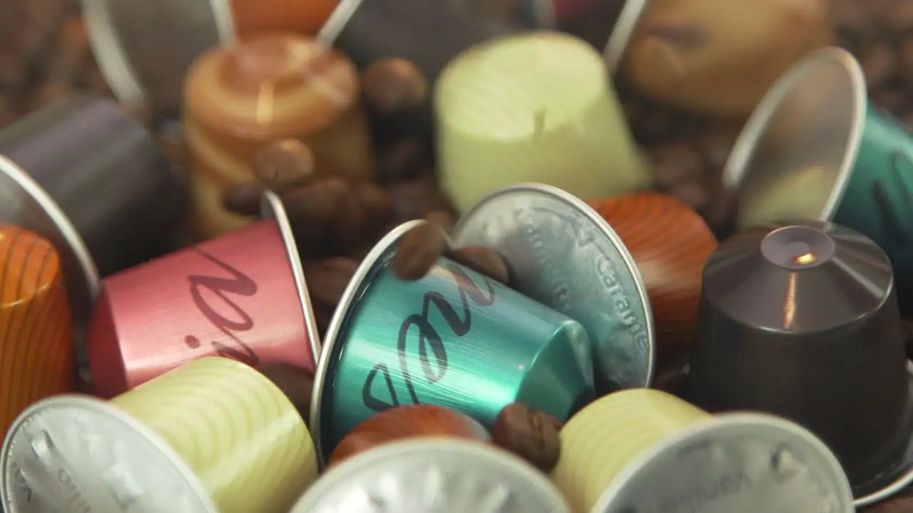 120fps slow motion coffee beans falling on nespresso coffee capsules