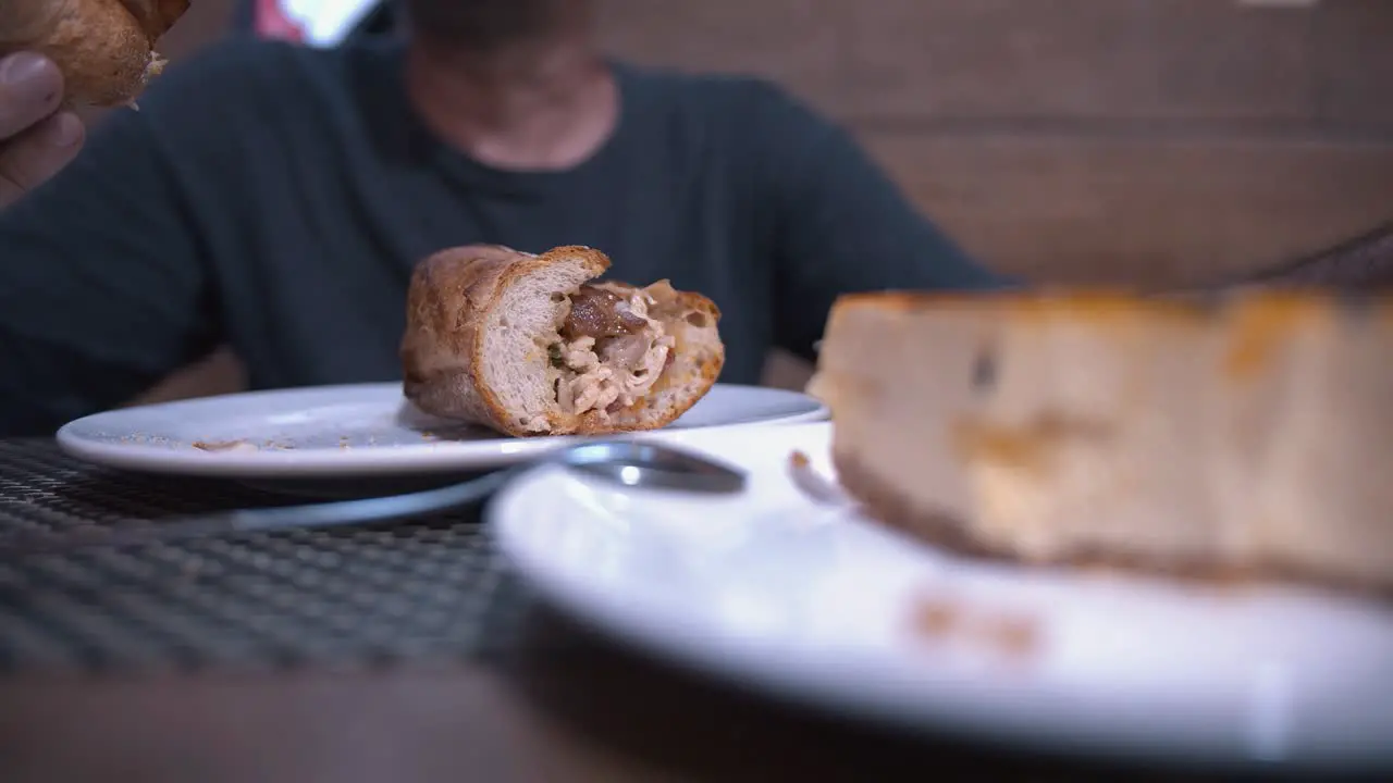 Couple Enjoying Dinner Baguette and a Cheesecake