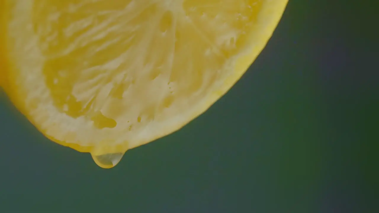 Juice Drips From a Cut Lemon