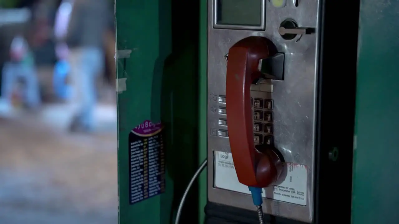 Close up of an old payphone booth in downtown