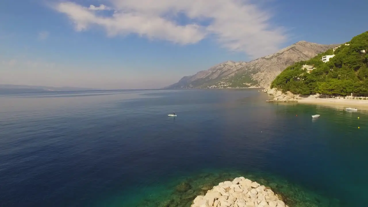 People kayaking in sea green nature and mountain