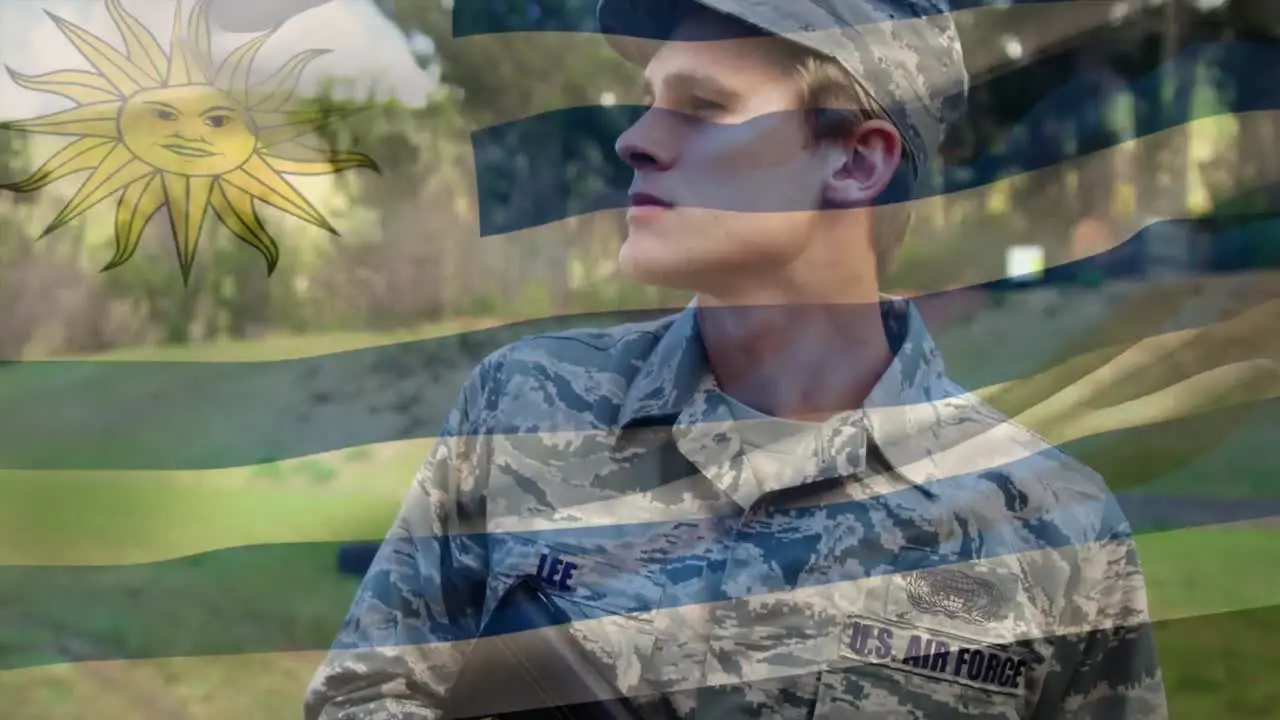 Animation of flag of uruguay over caucasian male soldier with gun looking away