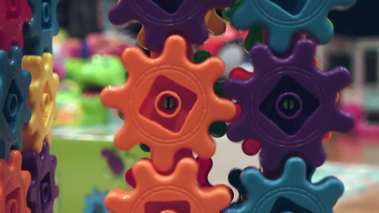 Colorful kids gears spinning close up