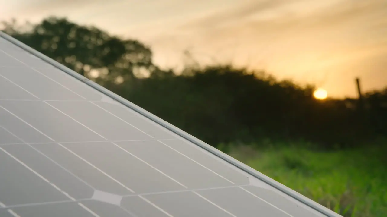 A solar panel PV CLOSEUP shot in a rural setting at golden hour