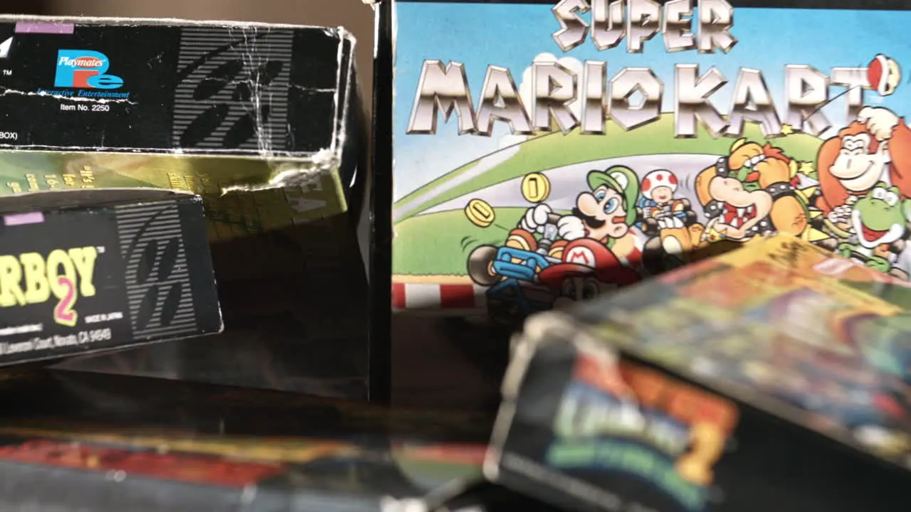 Vintage Super Mario Kart Box with Other Games Surrounding SLIDE LEFT