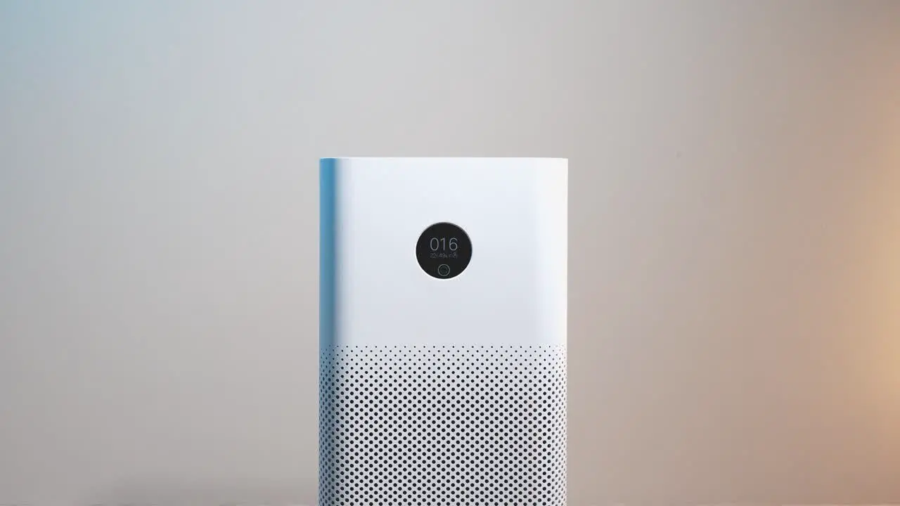 Close-up of an air purifier with a display showing good air quality