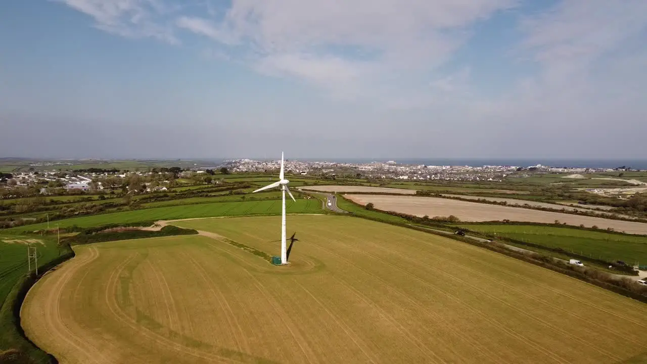 Wind turbine amidst green countryside in the UK 2